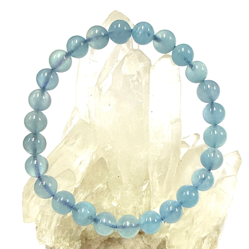Blue Aquamarine Bracelet 7mm beaded bracelet on a white background
