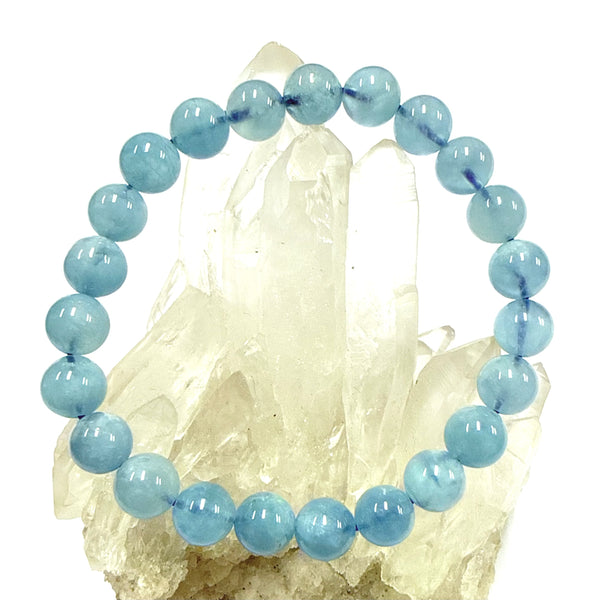 Blue Aquamarine Bracelet 8mm beaded bracelet on a crystal background