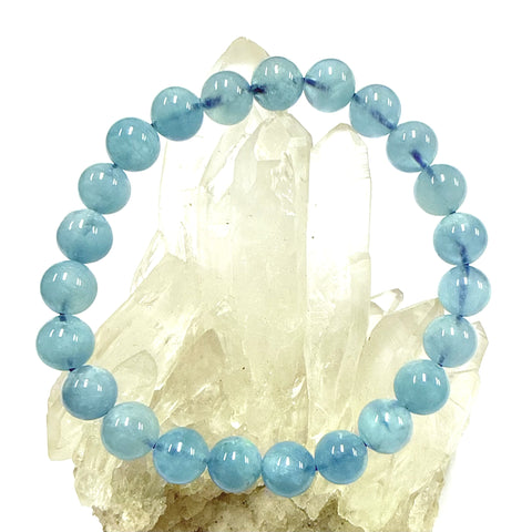 Blue Aquamarine Bracelet 8mm beaded bracelet on a crystal background
