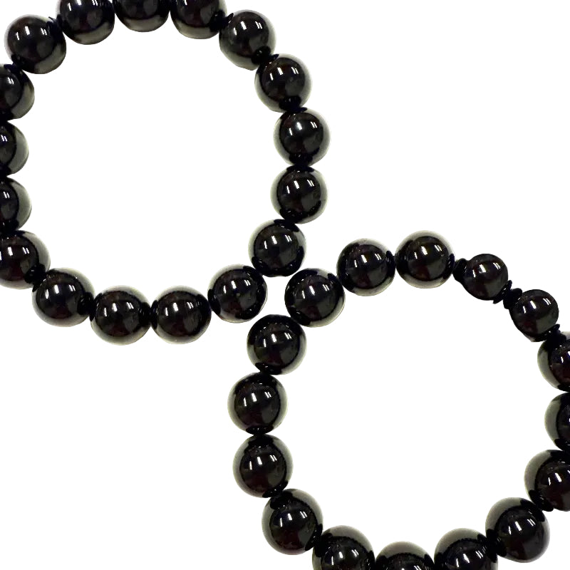Black tourmaline beaded bracelet on a white background