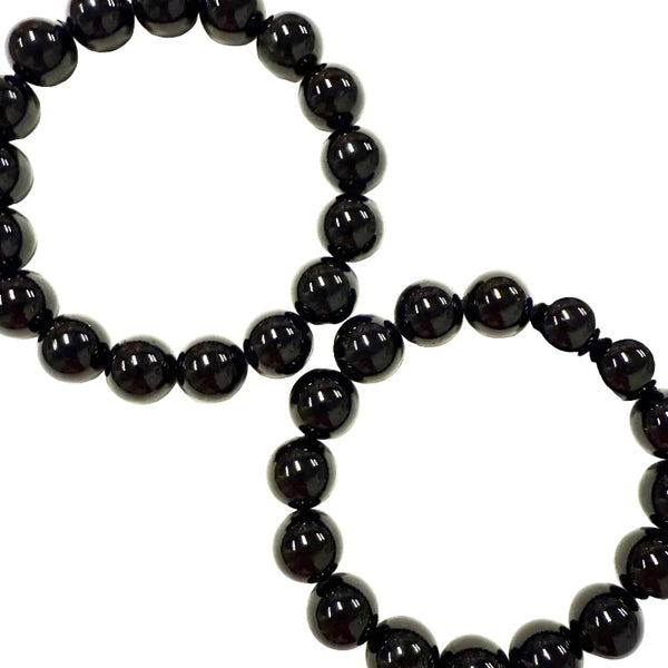 Black tourmaline beaded bracelet on a white background