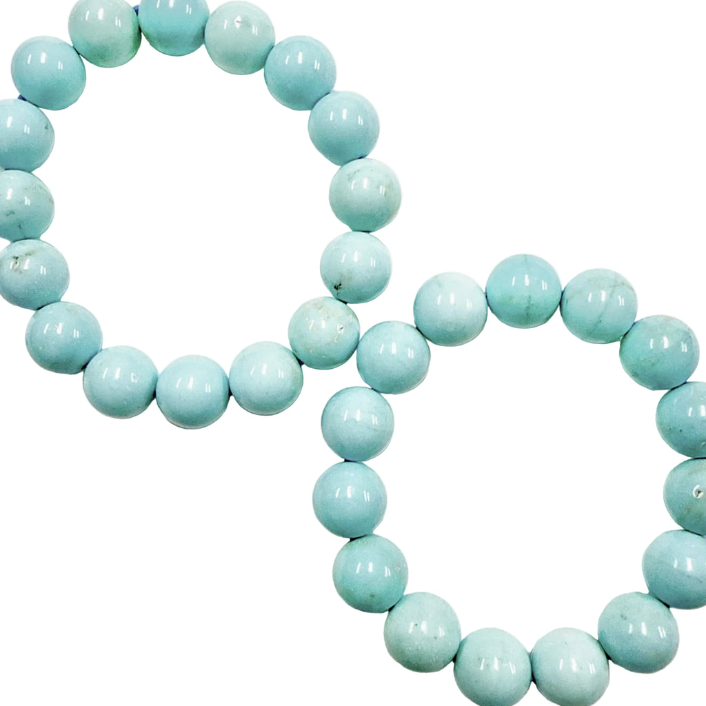 Blue Howlite 12mm beaded bracelet on a white background