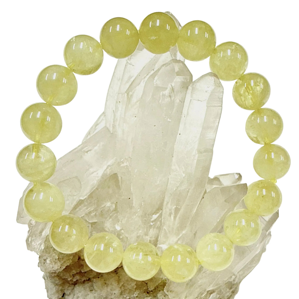 Yellow Citrine beaded bracelet on a crystal base with a white background