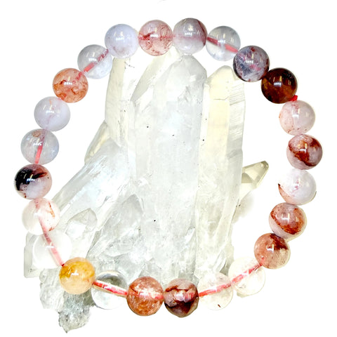 Fire Quartz beaded bracelet on a crystal background