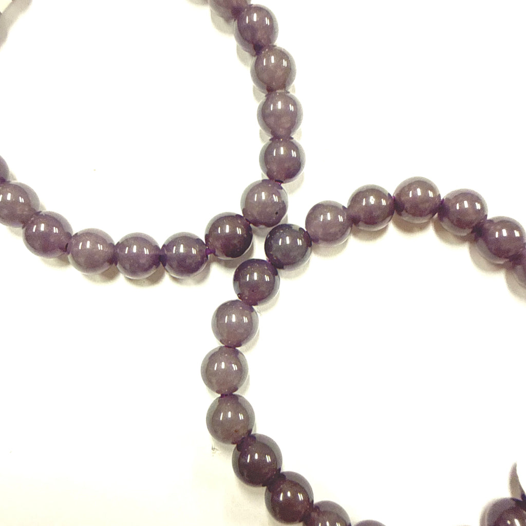 Close-up of 2 Purple Chalcedony beaded 8mm Bracelet on a white background