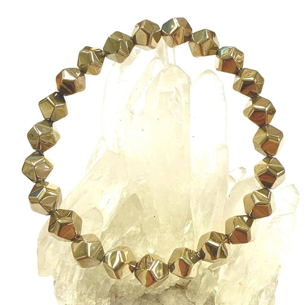 Gold beaded bracelet Pyrite Dodecahedron beads on a crystal background
