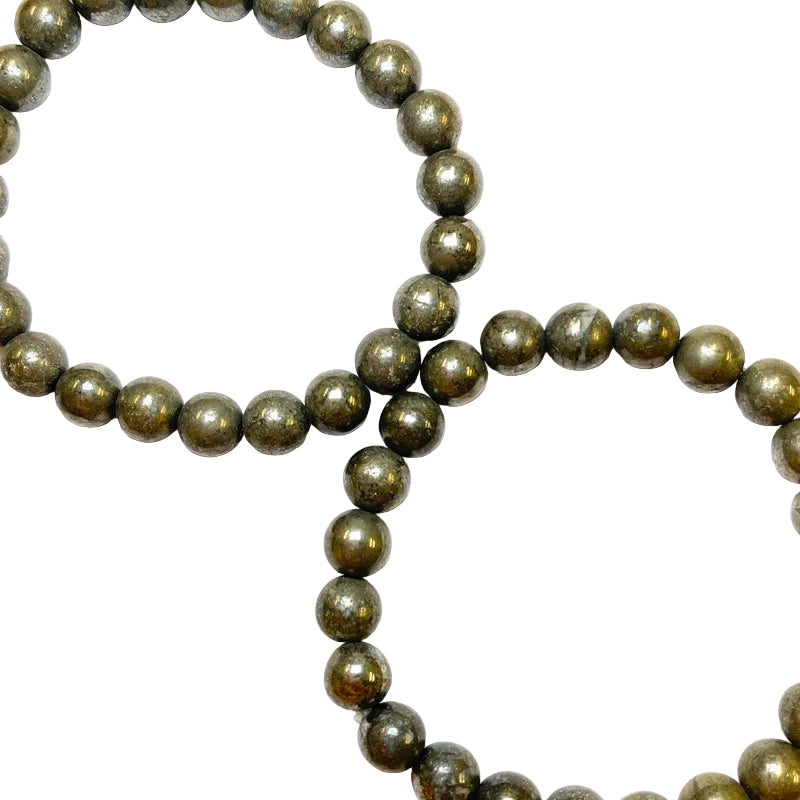 A bracelet made of polished pyrite beads with a solid color and smooth surface, displayed on a white background.