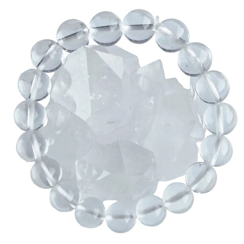 A clear quartz bracelet beaded, displayed on a plain background.
